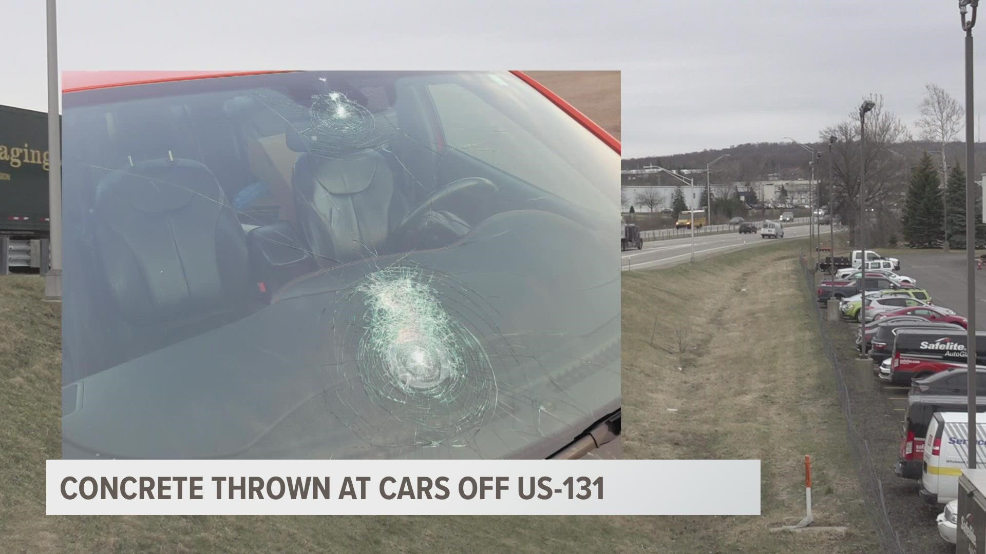 One of the drivers says he witnessed two young, white males with short hair throw an object that damaged his car.