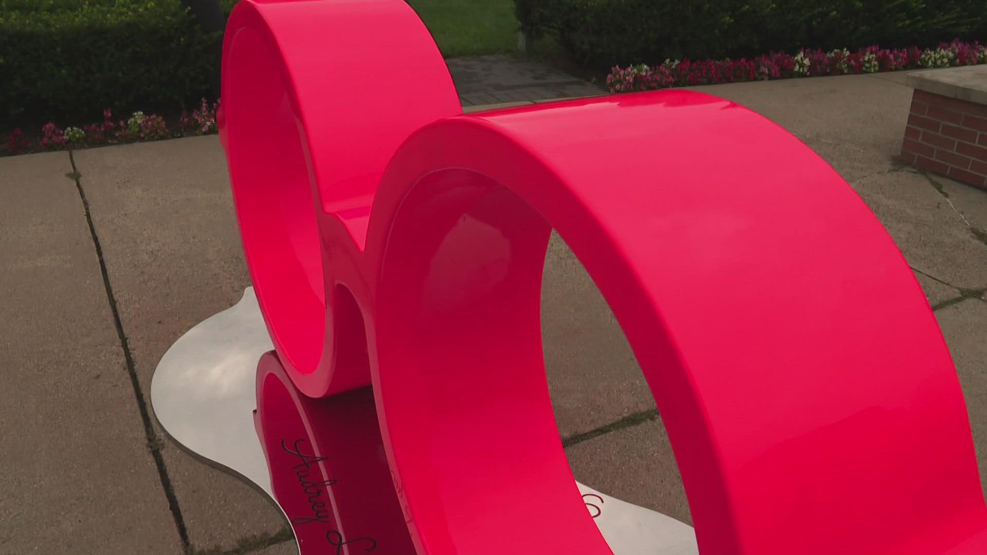 Artist Sam Noordhoff was inspired to create the sculpture "Red Glasses" after a 5-year-old girl passed away in 2018. She was known for her red glasses.