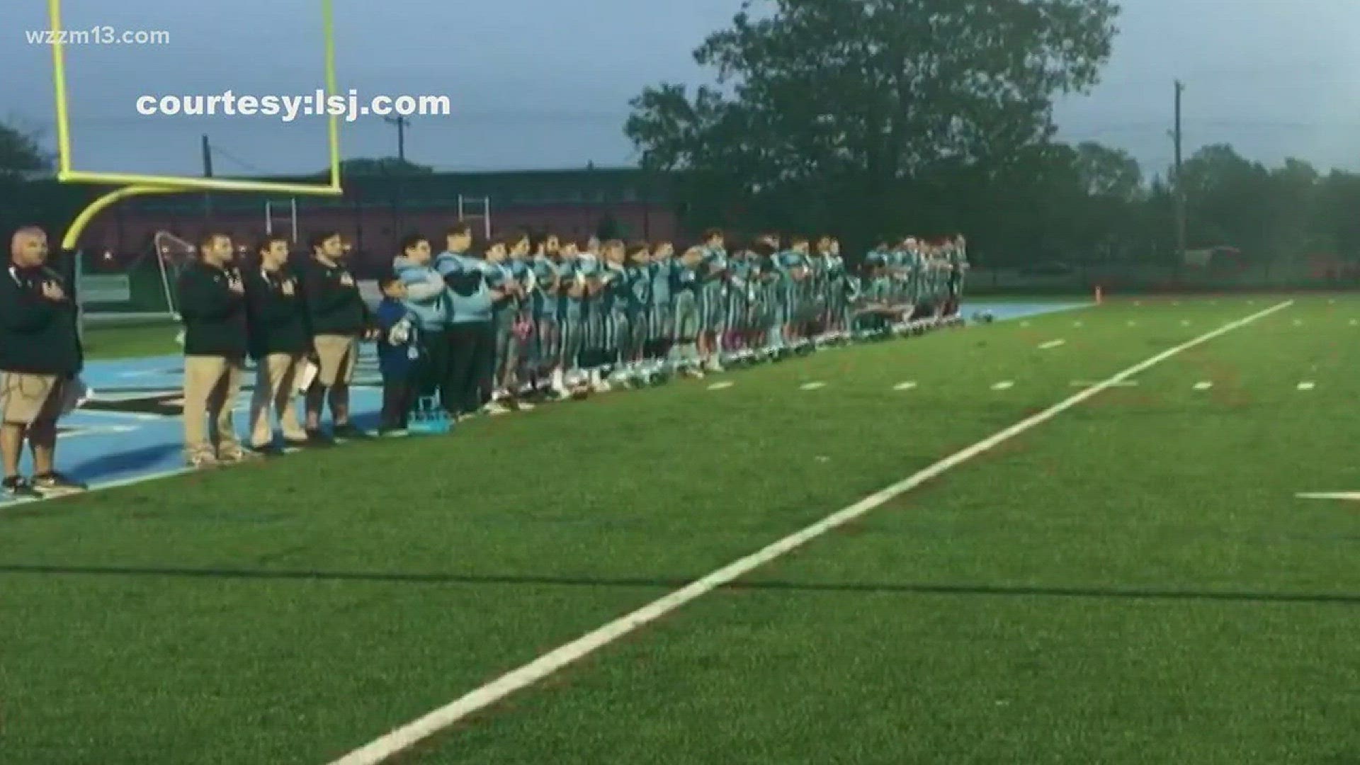 Lansing high schoolers take a knee