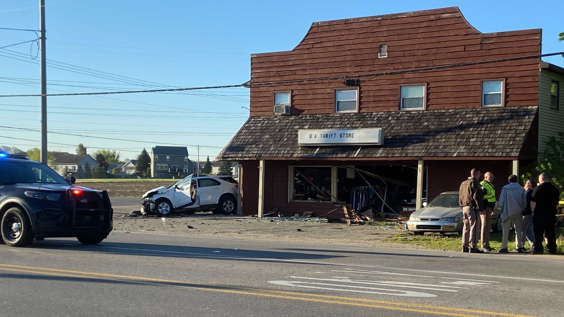 2vehicle crash ends with truck driving into Hudsonville thrift shop, 3 injured