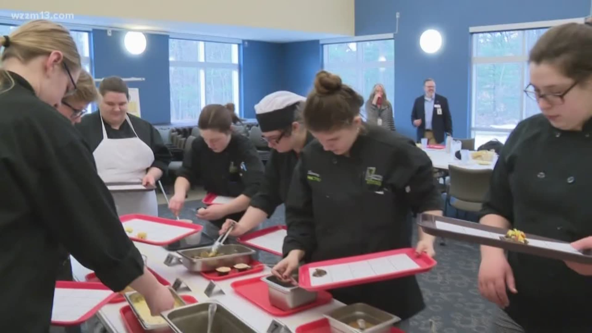 Students working mushrooms into school lunches