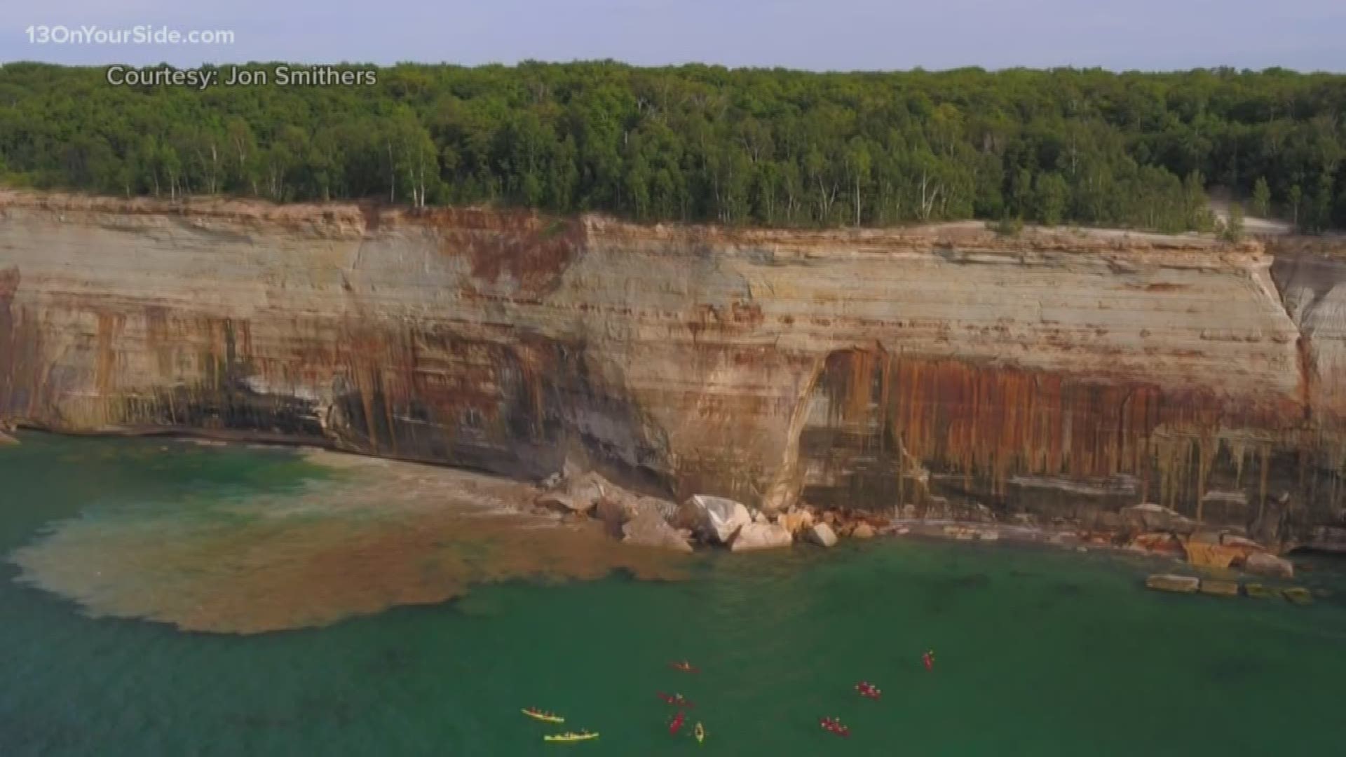 Kayakers on a tour of Pictured Rocks National Lakeshore in northern Michigan narrowly escaped injury when a large section of cliff collapsed near them into Lake Superior.