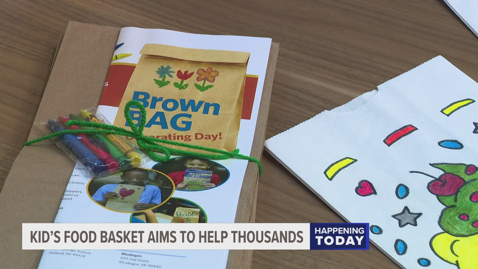 The decorated brown bags will be used to distribute thousands of meals to children in need.