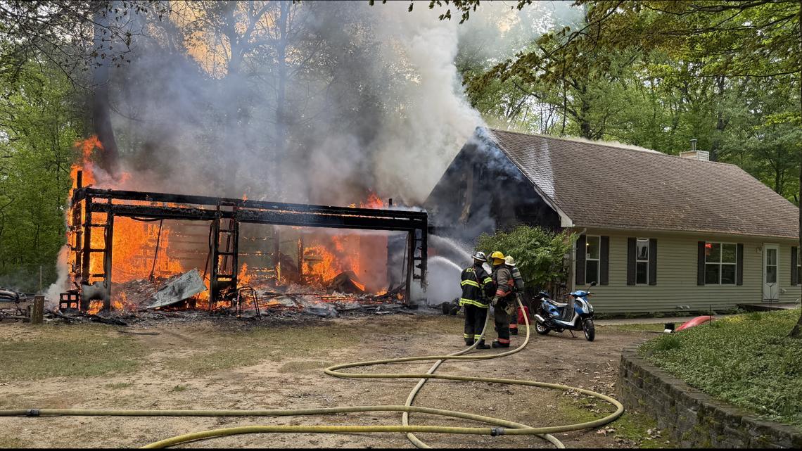 Garage destroyed, home damaged in fire sparked by boat engine
