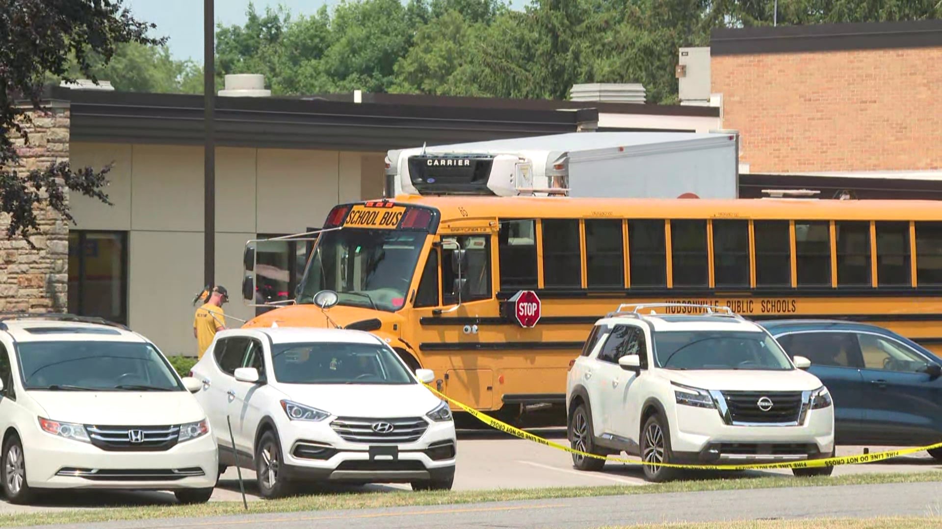 Box truck driver hits bus, multiple cars at Ottawa Co. school | wzzm13.com