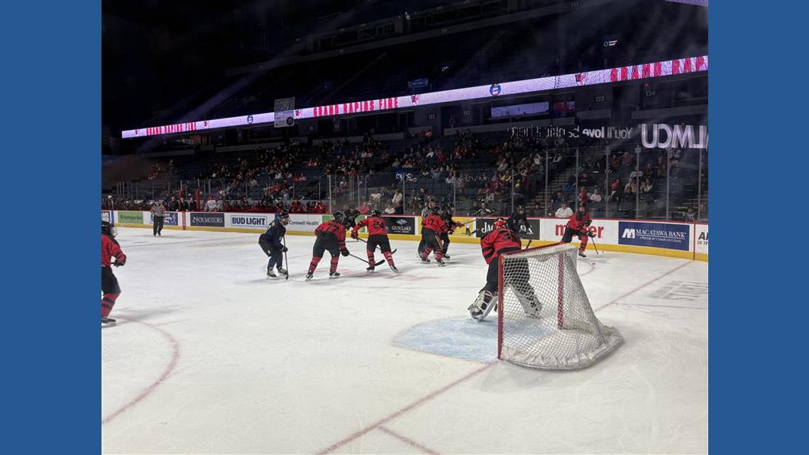 Grand Rapids fire, police departments square off in annual charity hockey game