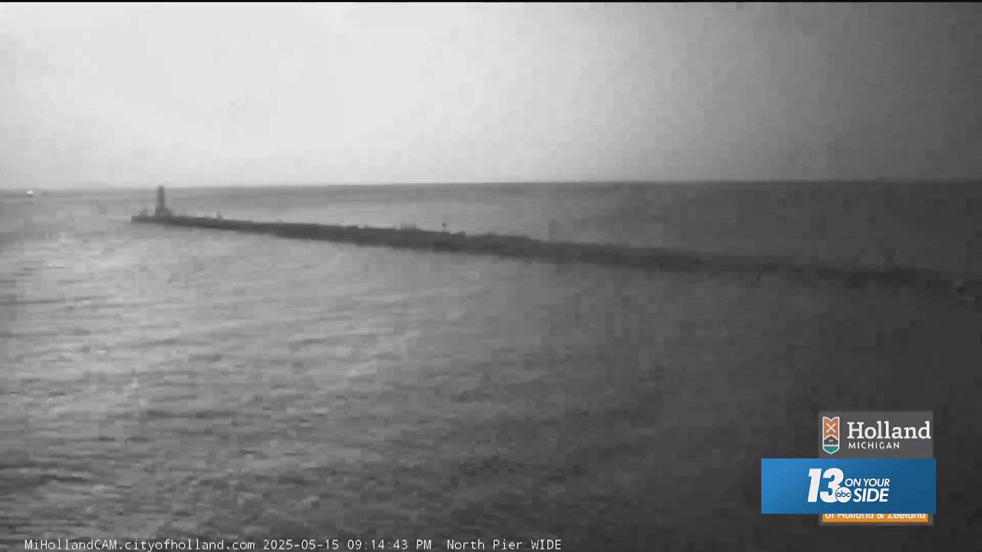 People walking on a pier in Holland during a thunderstorm.