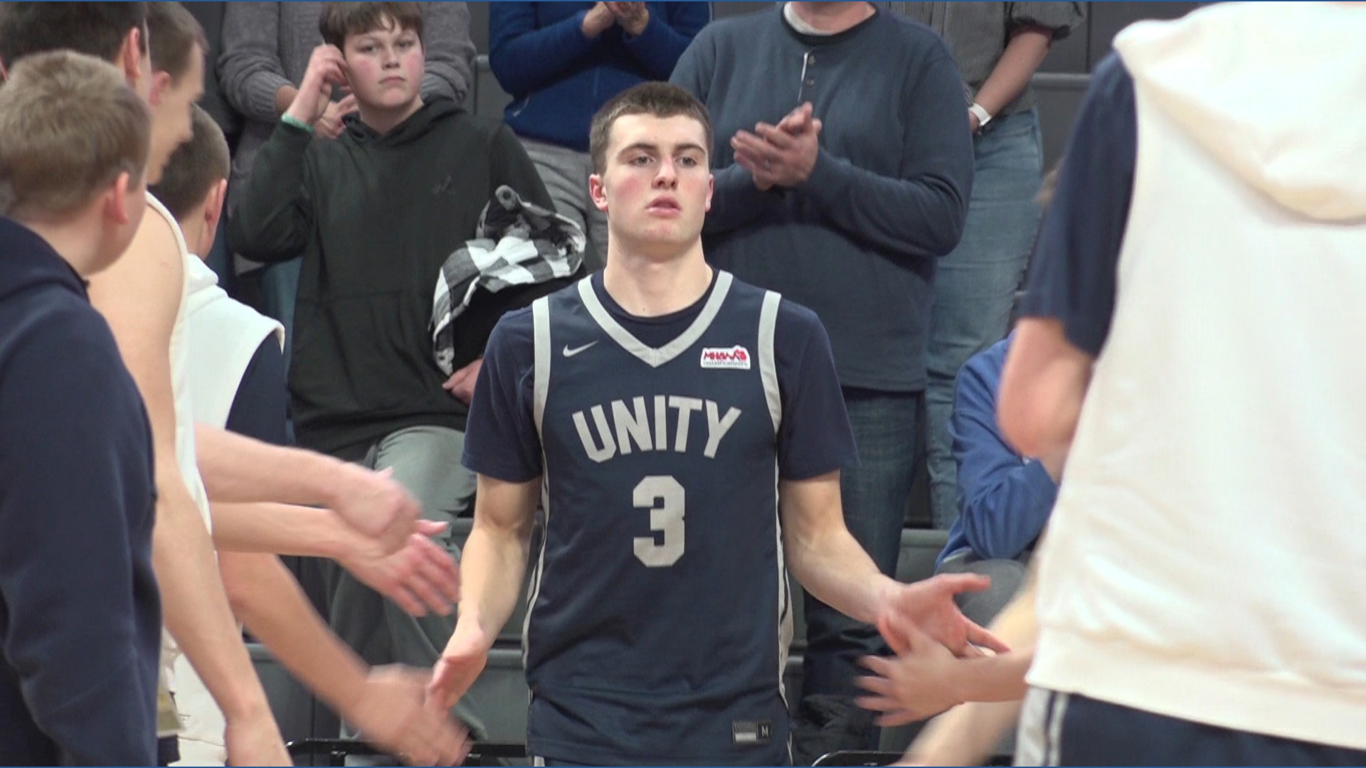 Unity Christian advances to boys basketball state title game | wzzm13.com