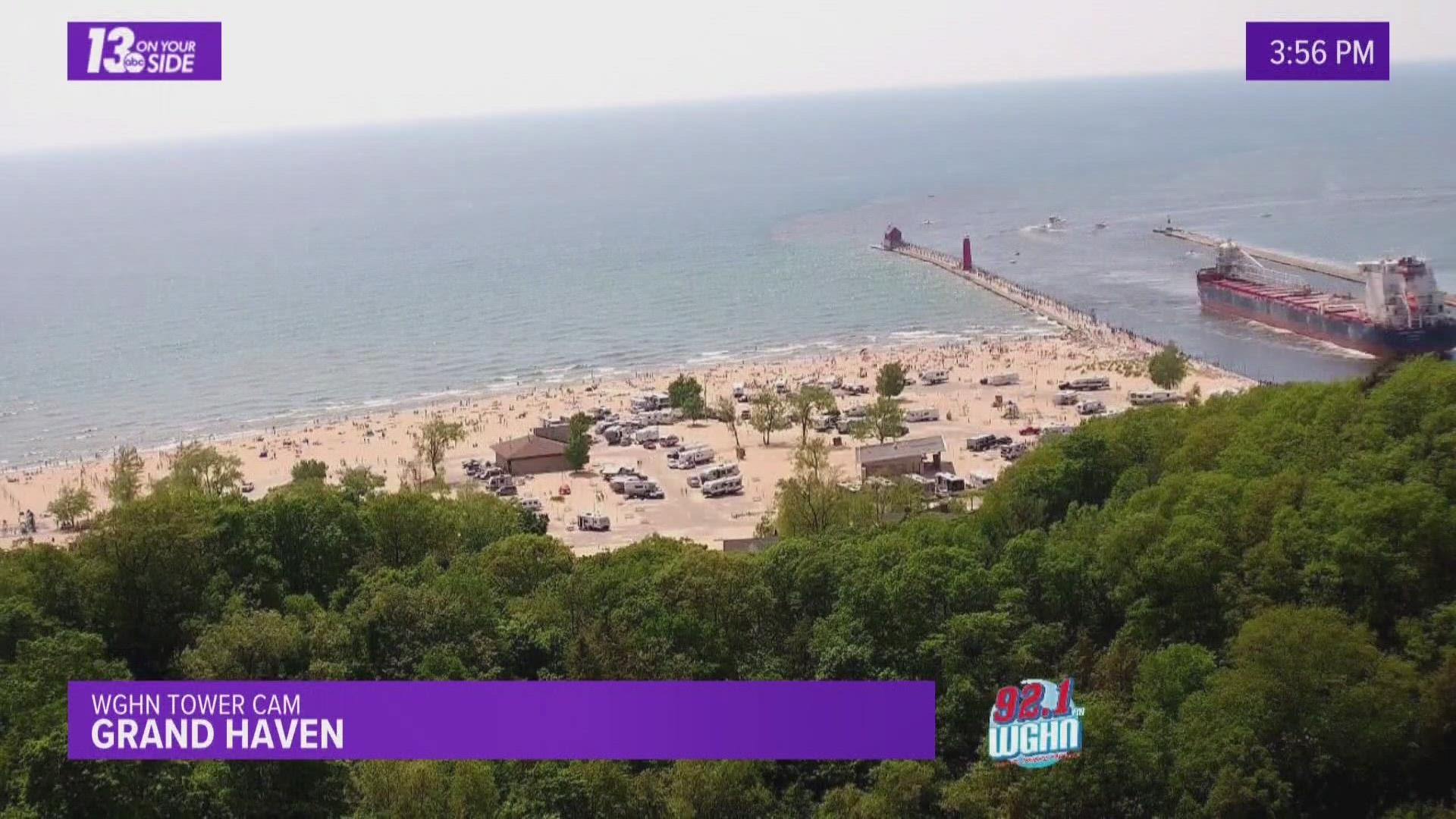 Two swimmers and two members of a human chain were rescued from Lake Michigan.