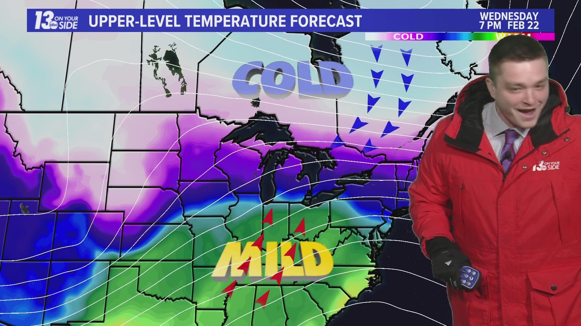 Meteorologist Blake Hansen was trying to convey to viewers that an impactful winter system could be headed our way later this week, but two cats had other plans.