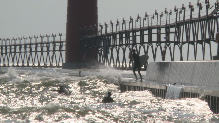 Surfers at Grand Haven State Park encourage beach safety after multiple water rescues Tuesday