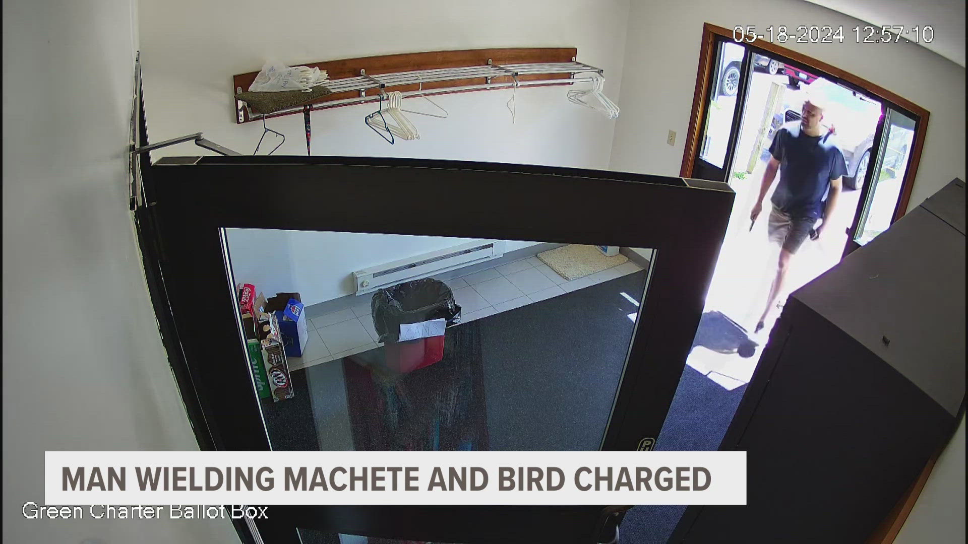 A man carrying a machete with a parakeet on his shoulder is in jail. He's accused of damaging a township hall, and interrupting a graduation party over the weekend.