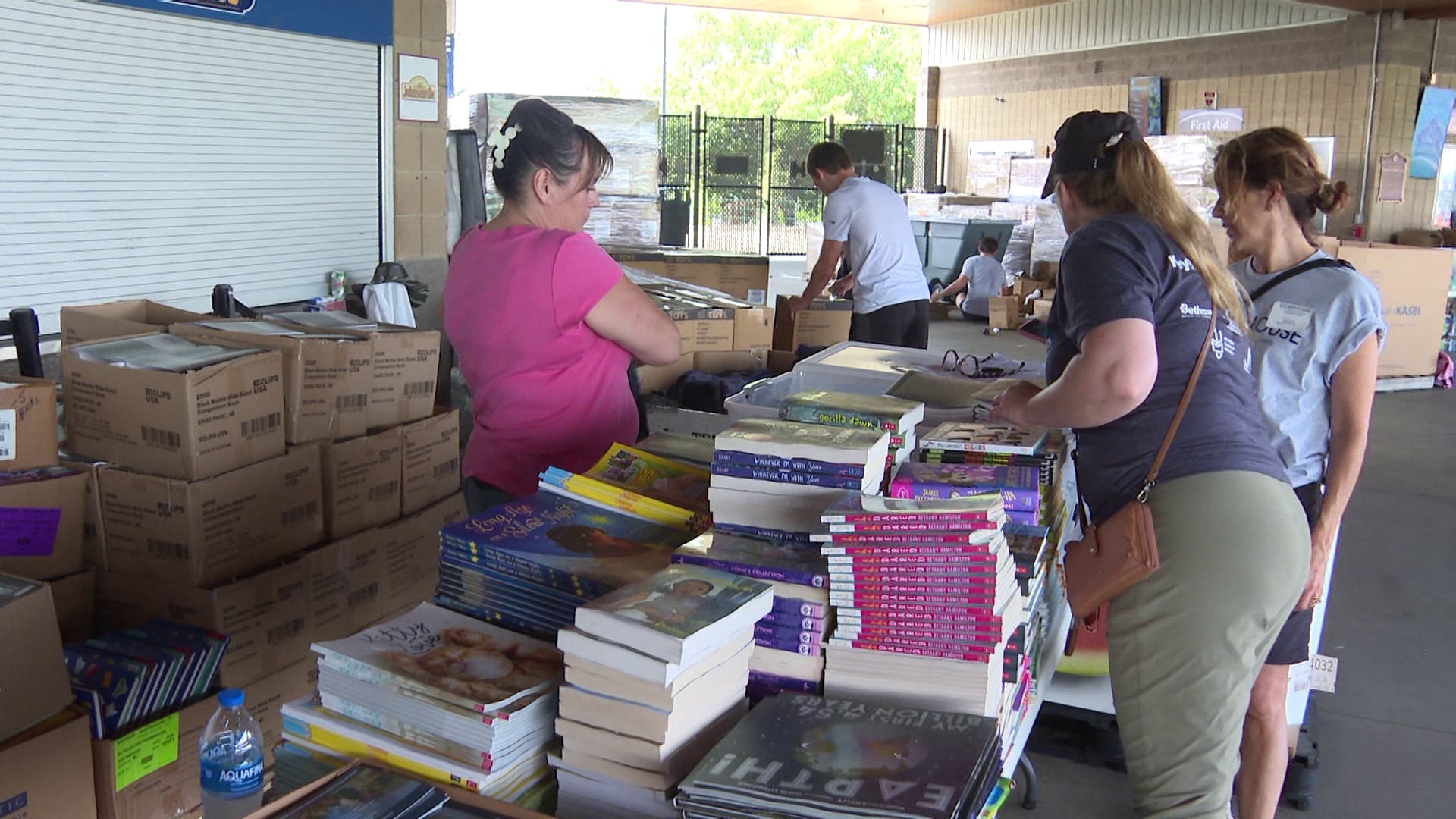 Over 100 volunteers helped fill thousands of backpacks with supplies on Thursday.