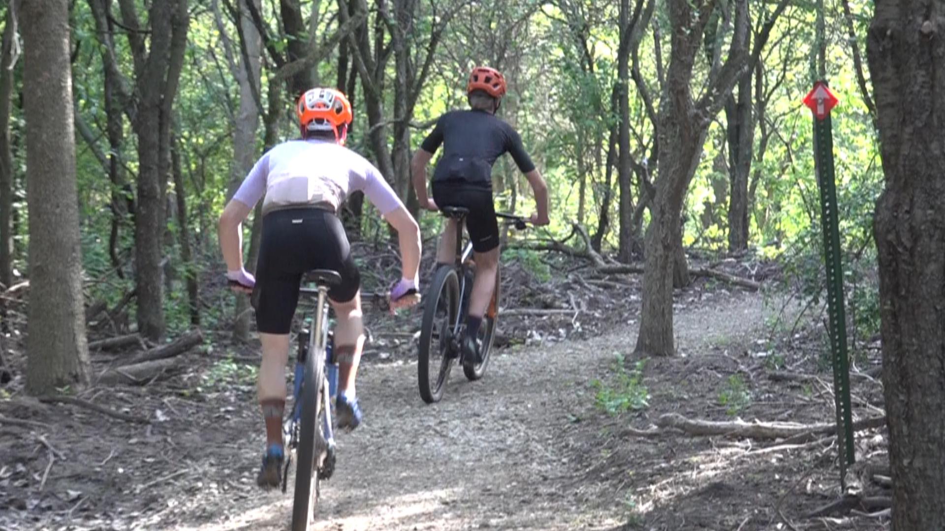 The Fred Bunn Multi-Use Trail allows people to walk, hike, run, and cycle at Manhattan Park.