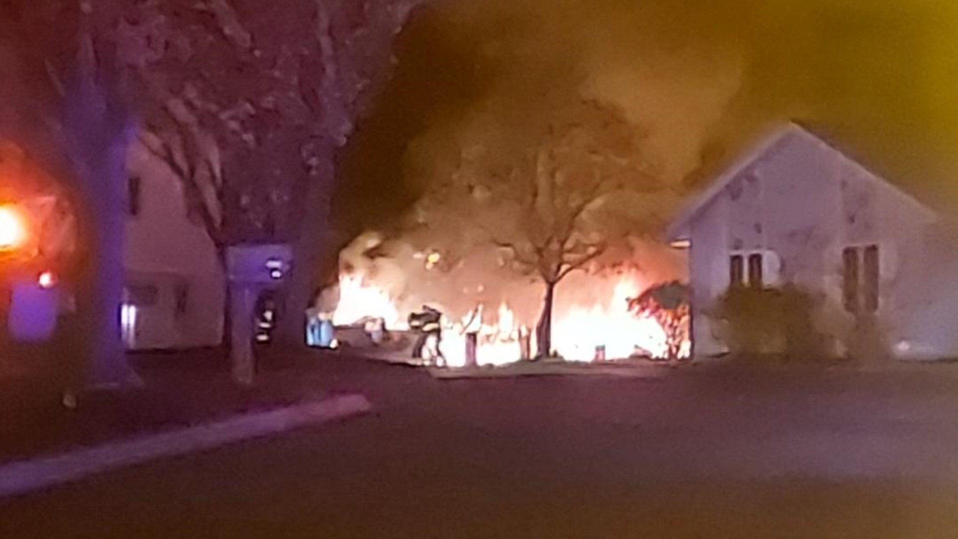 The fire started around 2:40 a.m. in a camper parked in the driveway.