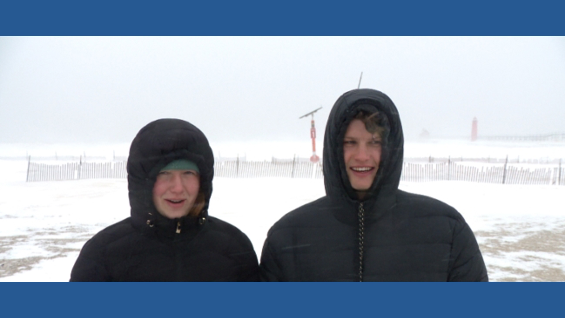 Australian Josiah Brooks experiences first snowstorm in Michigan up close at Grand Haven beach