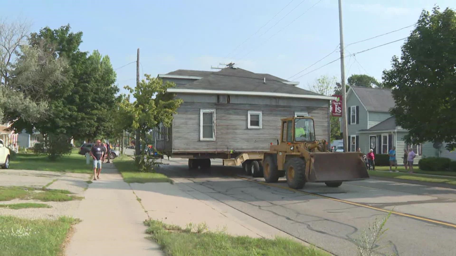 Workers uprooted a home in the Village of Sparta and moved it down the street to a vacant lot on Tuesday, Aug. 24.