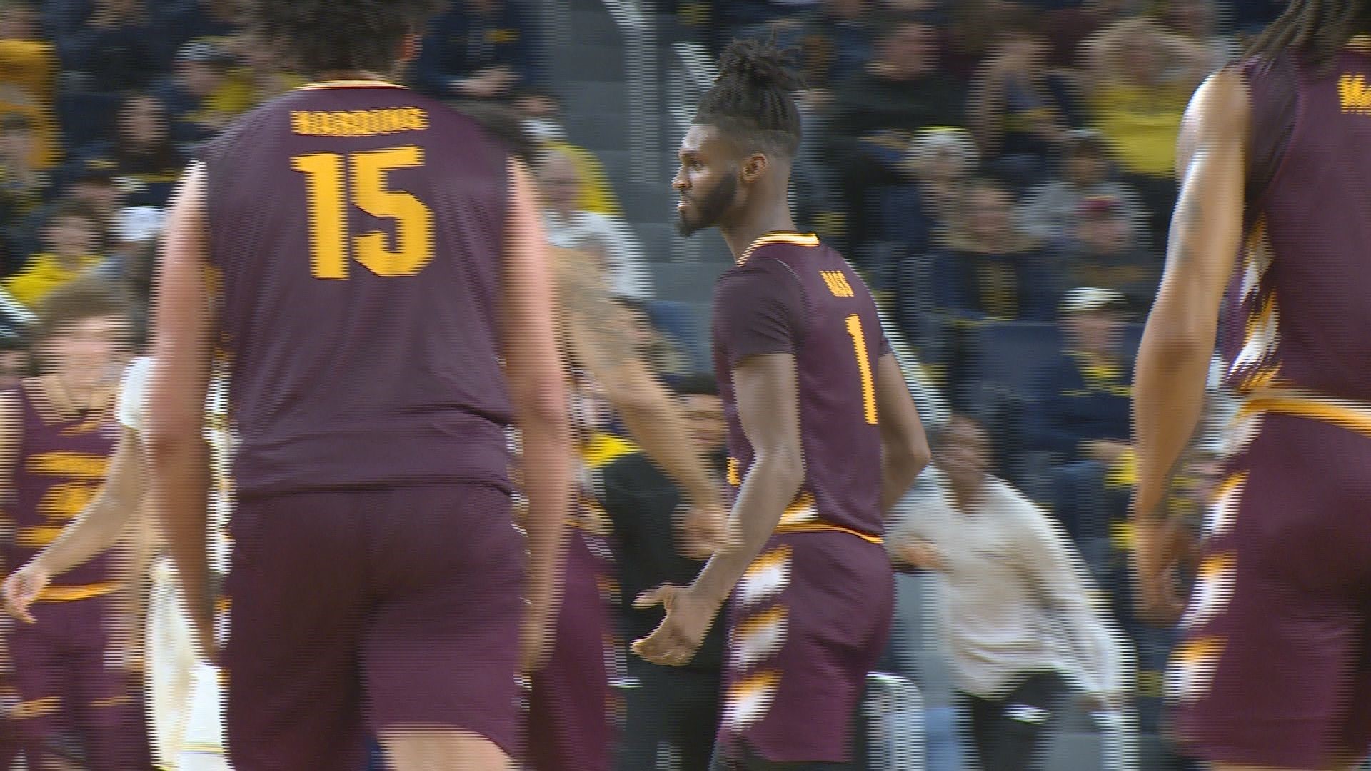 Reggie Bass drilled a 3-pointer with 11 seconds left and Central Michigan knocked off in-state rival Michigan 63-61.