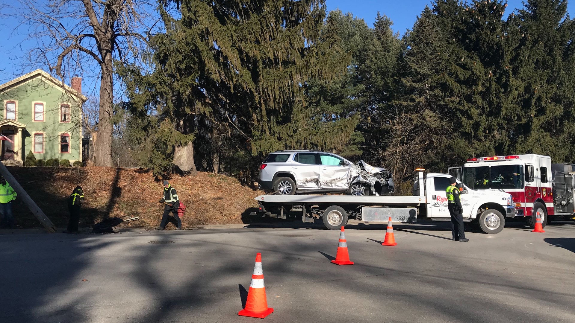 Power pole knocked down in Rockford after garbage truck and car crash
