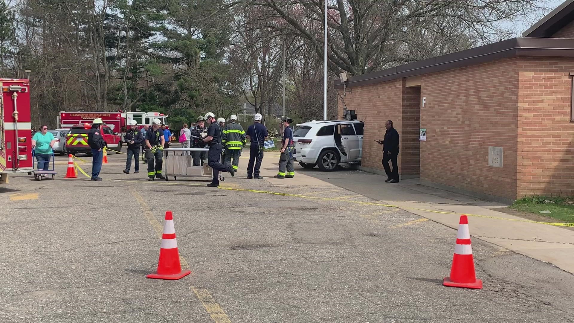 An SUV crashed into a building at Shawmut Hills School in Grand Rapids Friday afternoon. No injuries were reported.