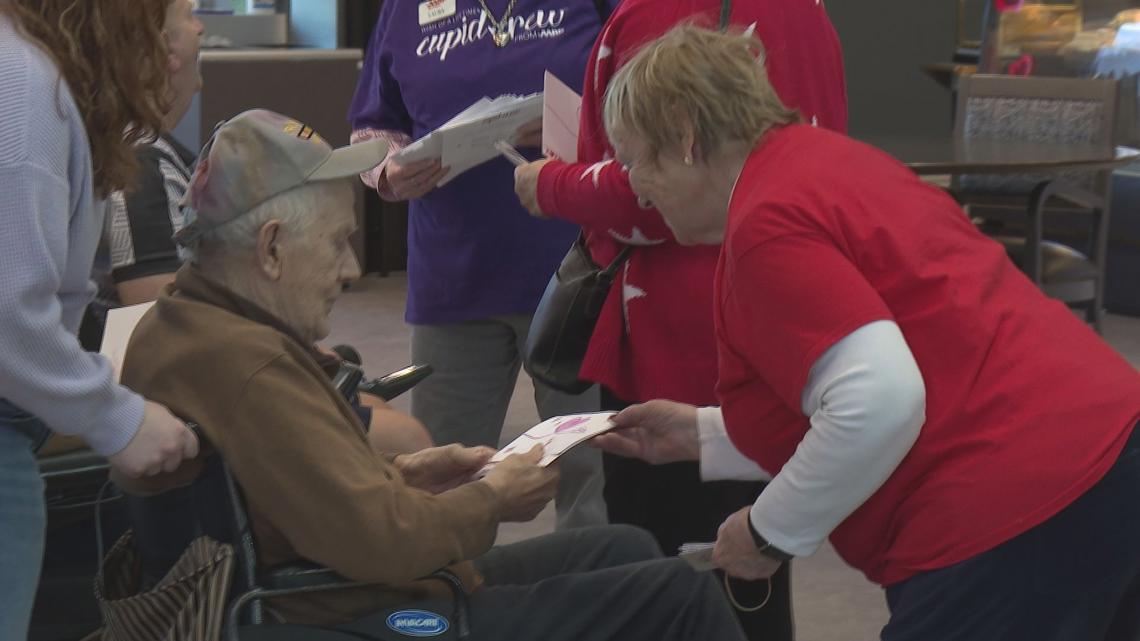 GVSU students team up with AARP volunteers to bring roses, Valentine's Day cards to older communities
