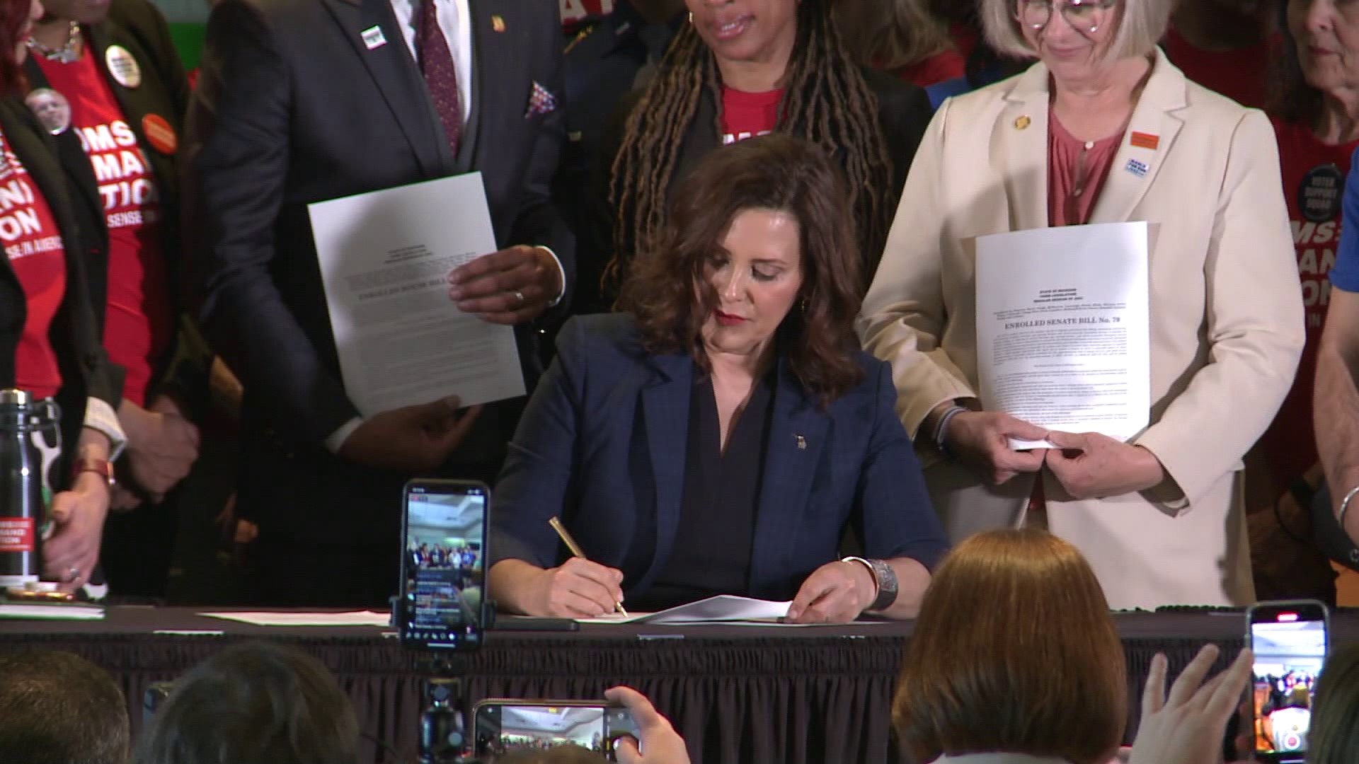 Whitmer signed the bills at Spartan Stadium in East Lansing. This comes exactly two months after the deadly shooting at Michigan State University.