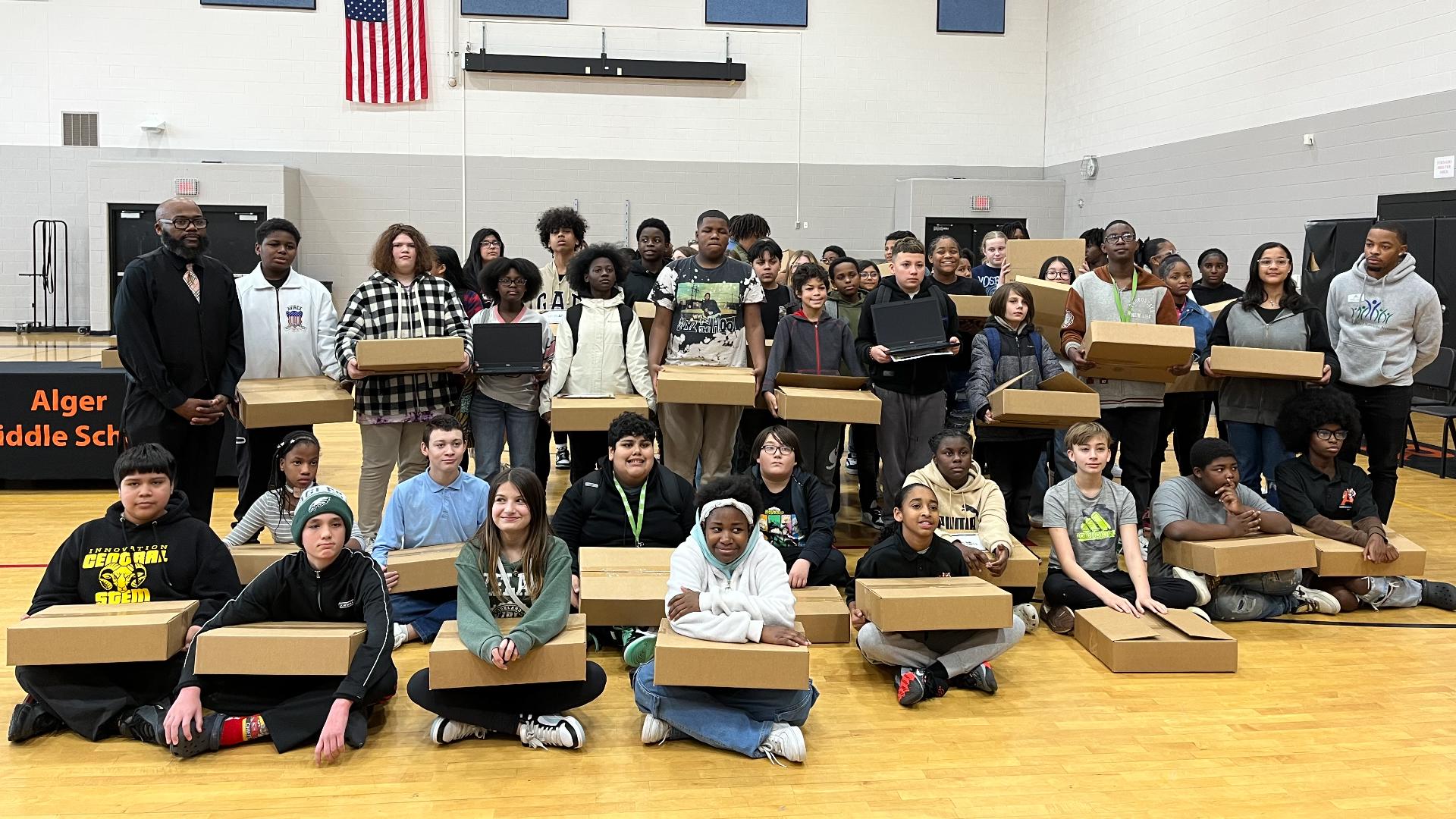 Nearly 50 students received a laptop thanks to AT&T, Human-I-T, the Greater Grand Rapids NAACP and Kent School Services Network.