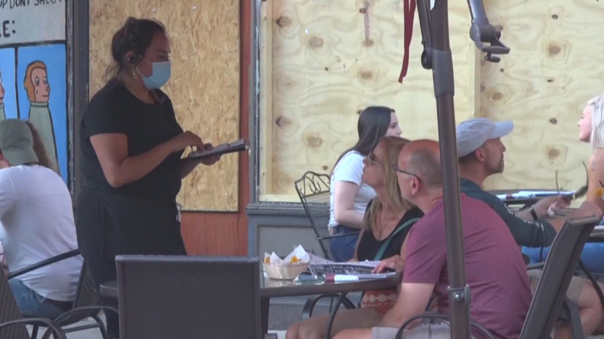 Gov. Gretchen Whitmer signed an executive order Friday requiring people to wear masks when they are in an indoor public space and in crowded outdoor spaces.