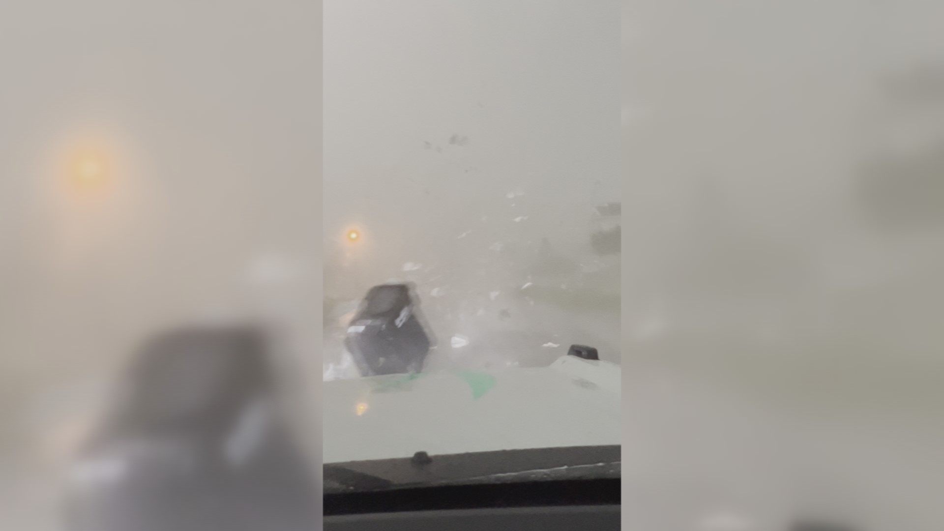 Viewer video shows high winds blowing debris across the road during the storms Thursday evening.
