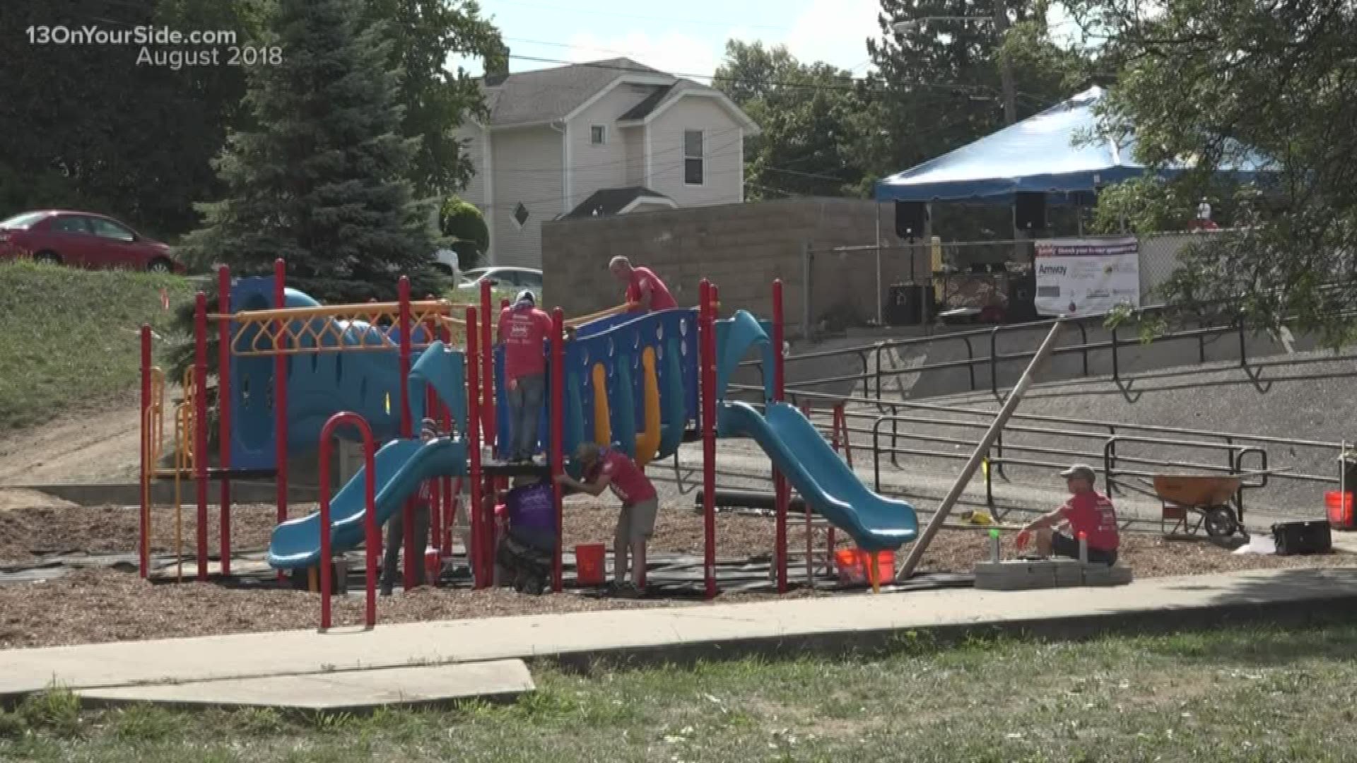 About 200 community volunteers are working Friday to build a new playground in Caulifield Park in Grand Rapids. The volunteers are from Amway, the City and Friends of Grand Rapids Parks all partnered up with KaBOOM! to upgrade the outdated park.
