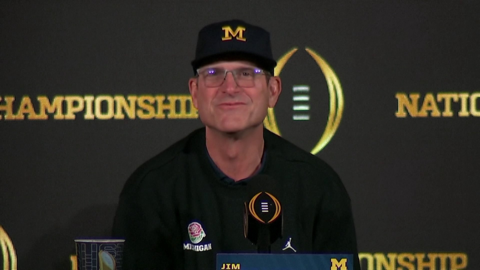 "My dad won a national championship, my brother won a Super Bowl...It's really cool. I feel like I can hold my head up high now," Michigan Coach Jim Harbaugh said.