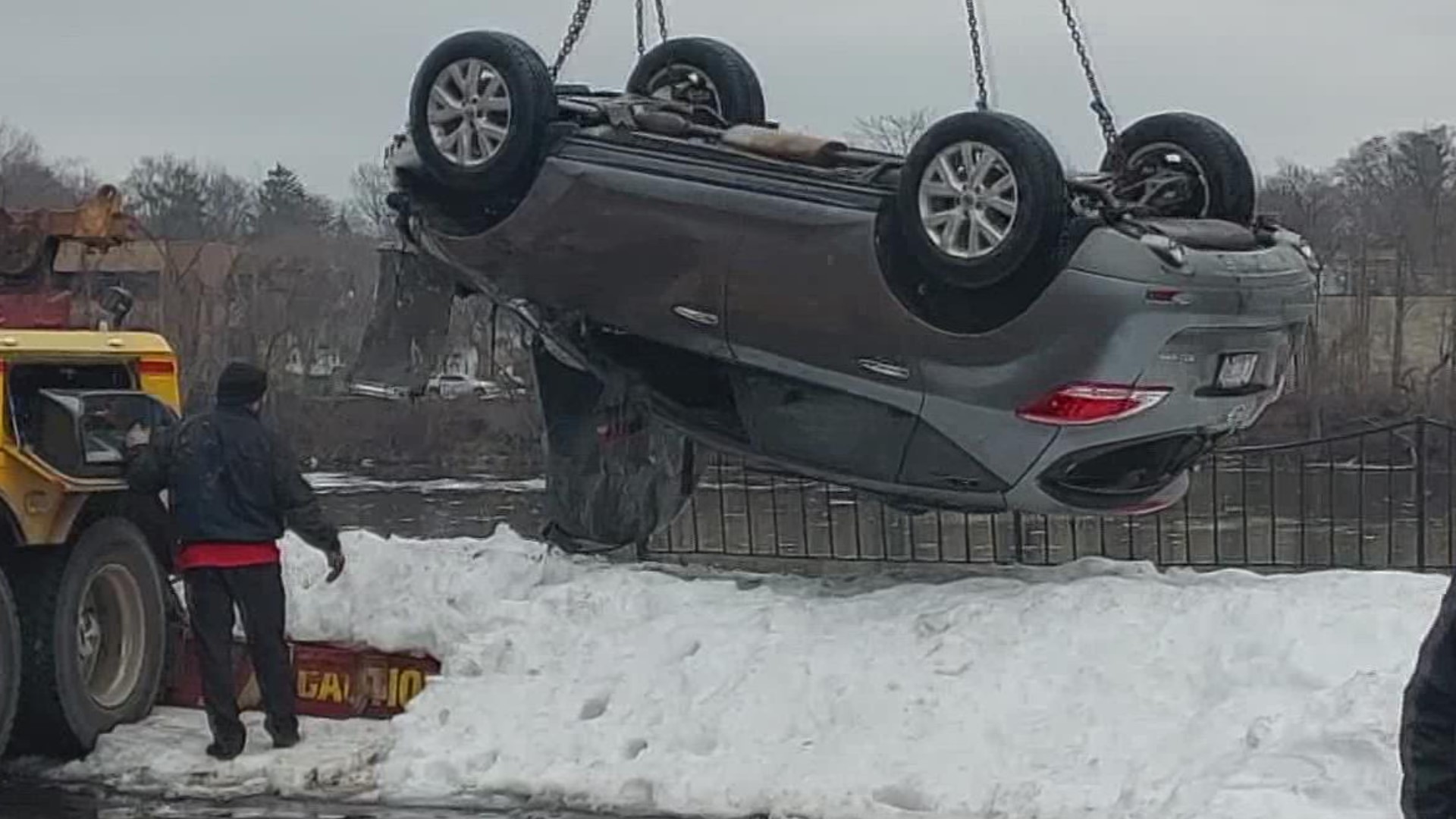 A car was pulled out of the Grand River Saturday morning after driving off a nearby road, the Grand Rapids Fire Department says.