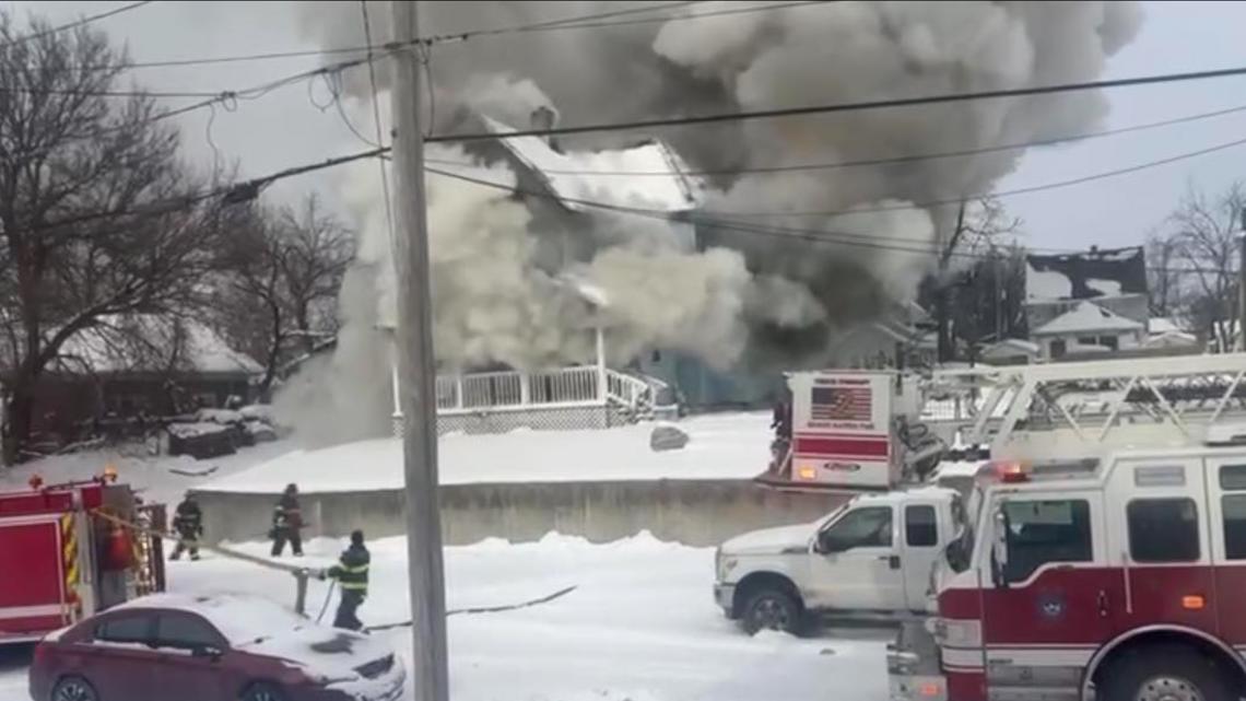 Crews fight large house fire in Grand Rapids during challenging winter conditions