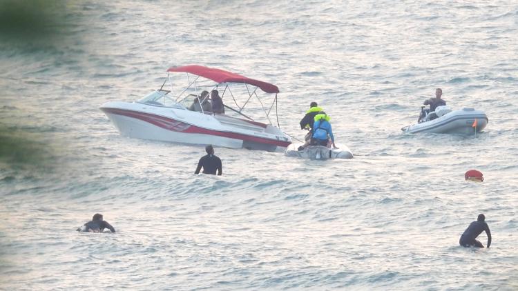 Bystanders help rescue 2 after boat capsizes | wzzm13.com