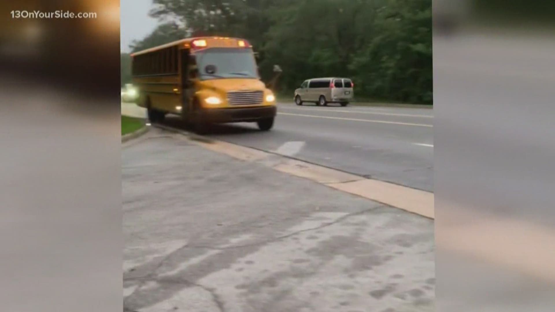Unless there's a physical barrier or unpaved median, drivers on both sides of a road must stop for school buses.