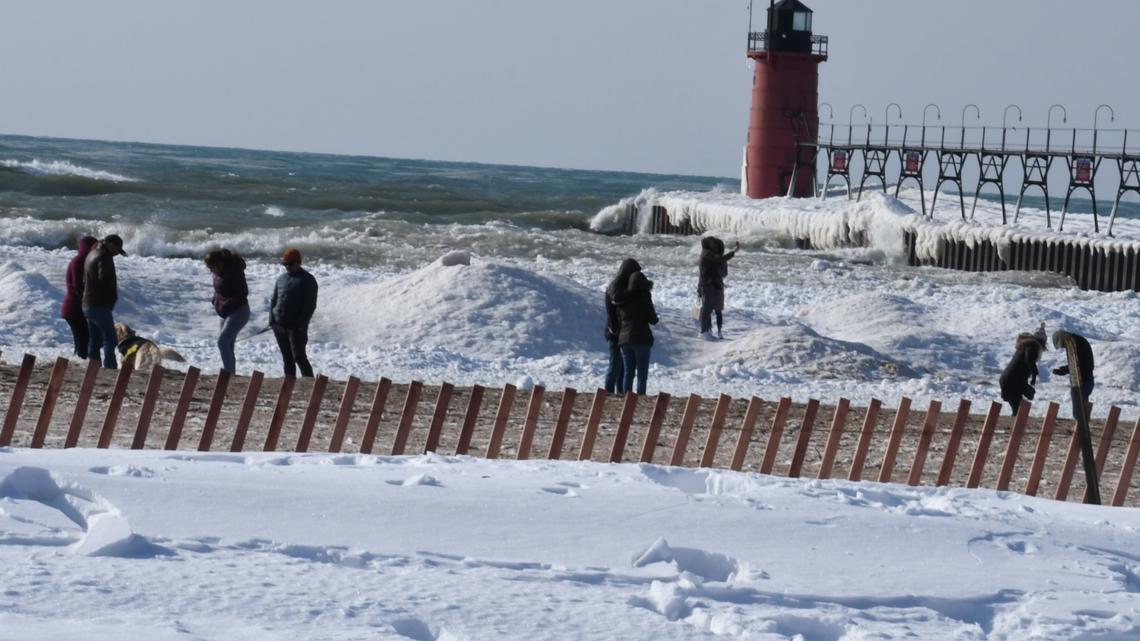 Person falls into Lake Michigan while walking on ice shelf