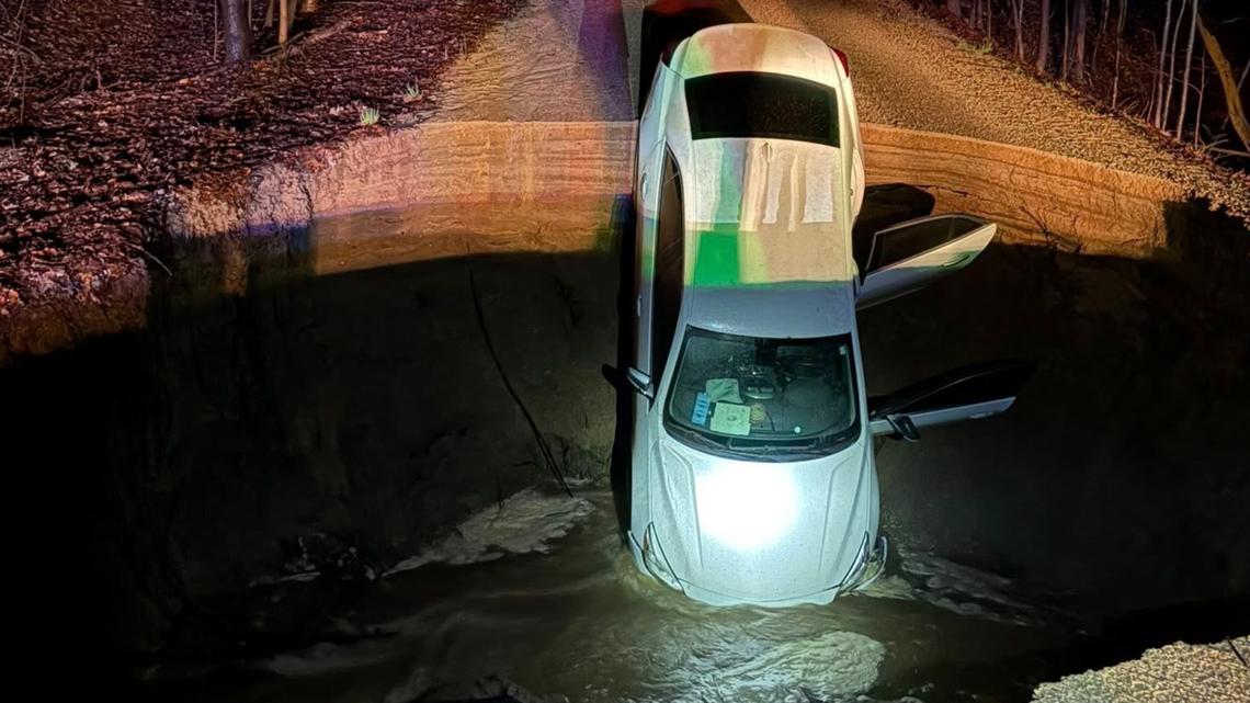 Car takes nosedive into massive sinkhole in Fremont | wzzm13.com