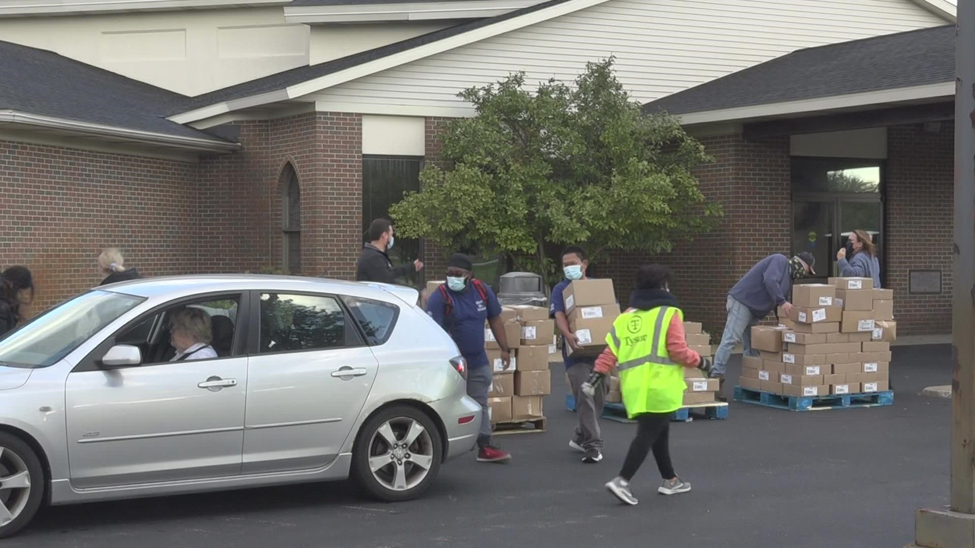 Volunteers from Tyson Foods' plant in Zeeland helped distribute the cases of food.