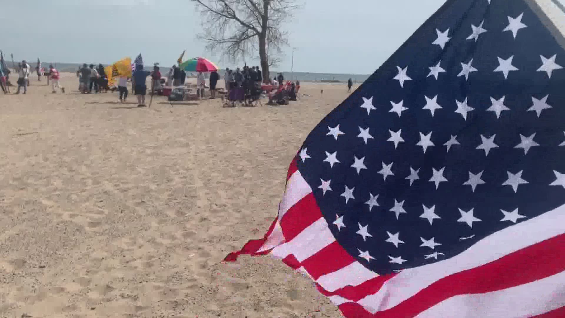The protest against the Michigan Department Natural Resources closing the parking lot at Grand Haven State Park drew in around 80 to 100 people throughout the day.