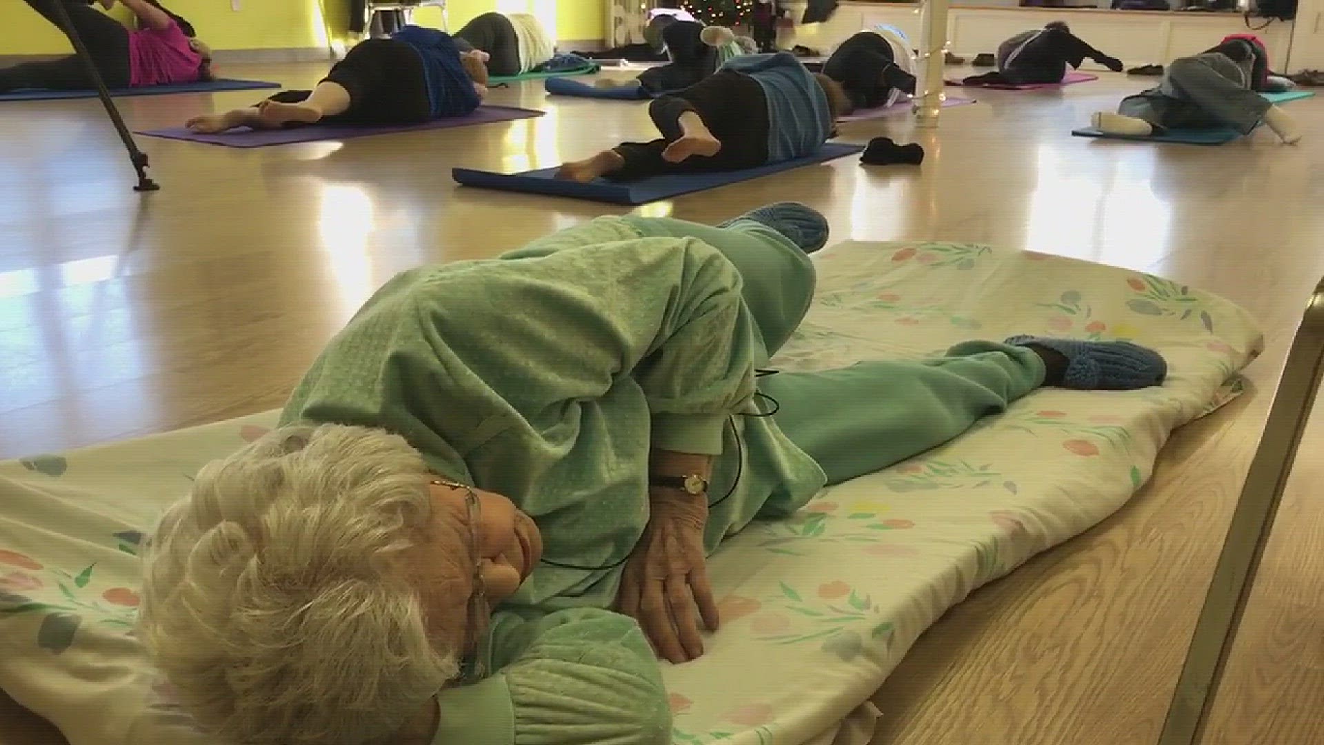 Lil Hansen teaching yoga in Ludington, Mich. on her 105th birthday!