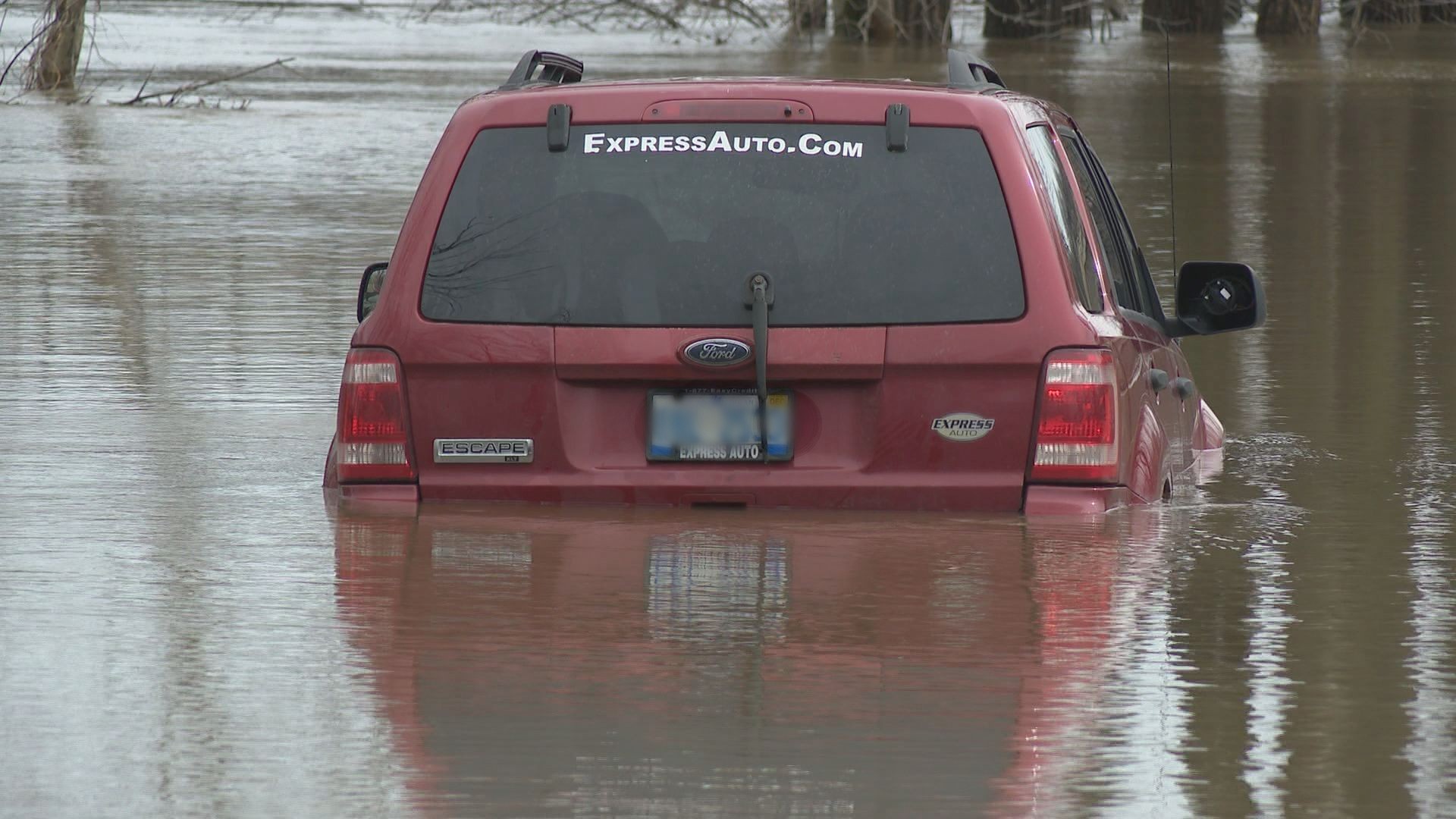 Authorities said the man is OK, and was able to wade back to shore after getting his SUV stuck in the flooded Thornapple River.