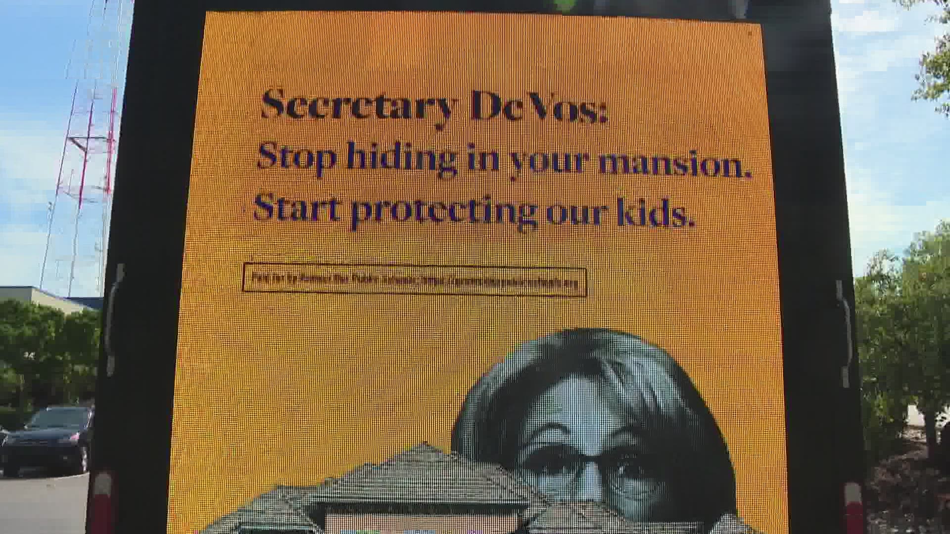 Mobile billboard criticizes DeVos' handling of the COVID-19 crisis, says she's 'gambling with kids' lives'
