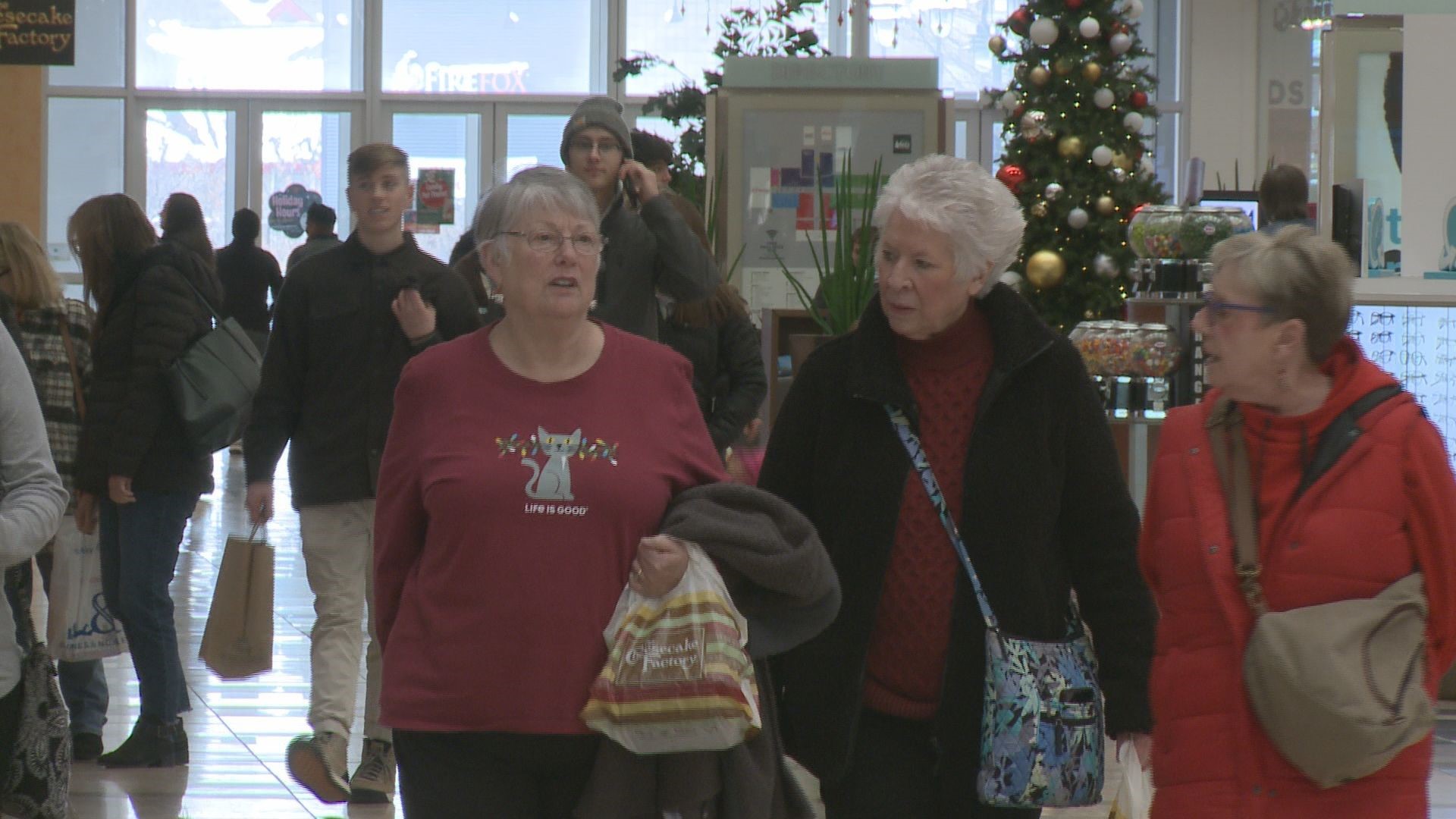 People at the Woodland Mall are getting some last minute gift shopping done, as well as making some fun holiday memories.