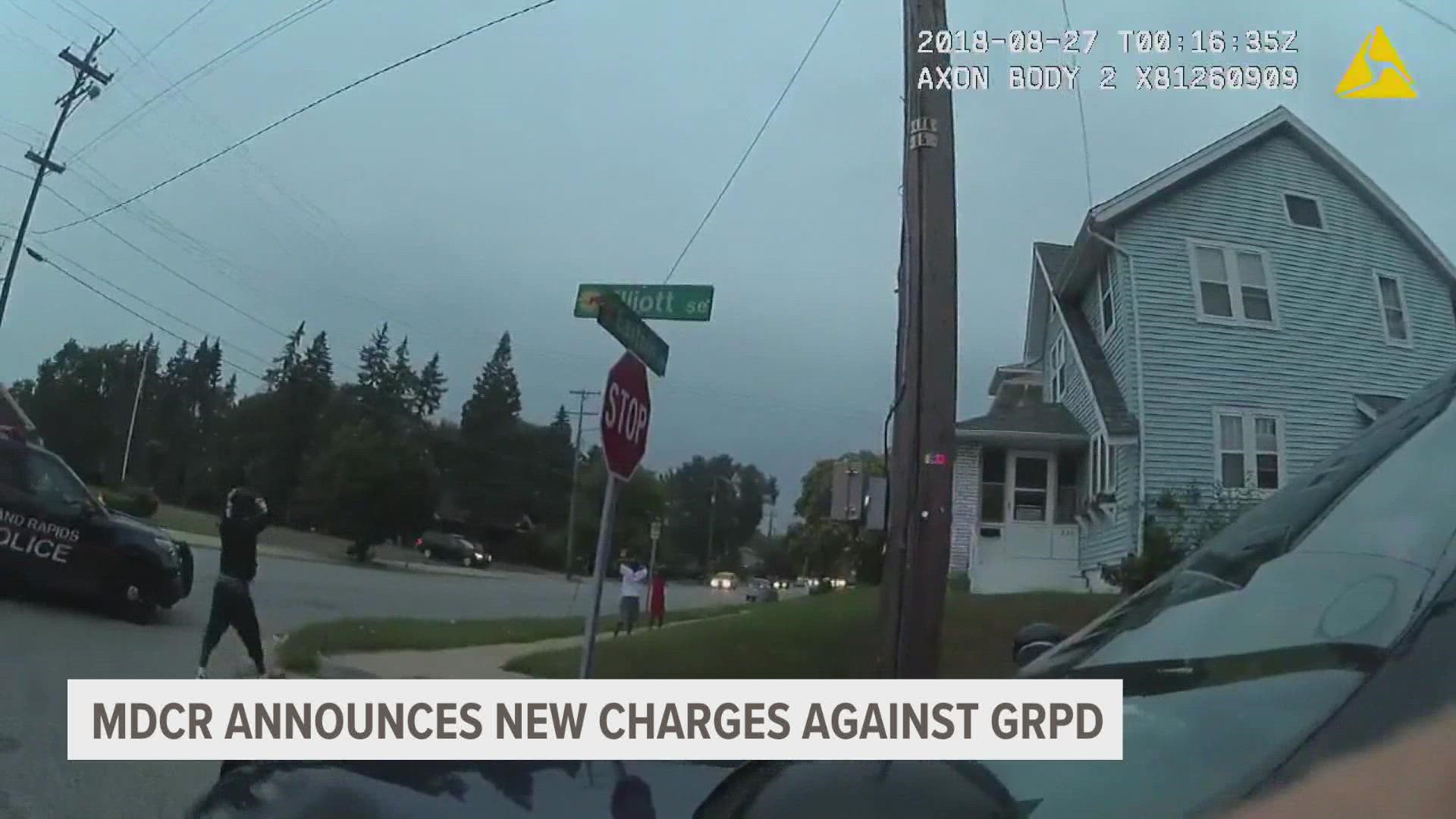 The charges stem from an interaction with two Black children in 2018 where officers held them at gunpoint.
