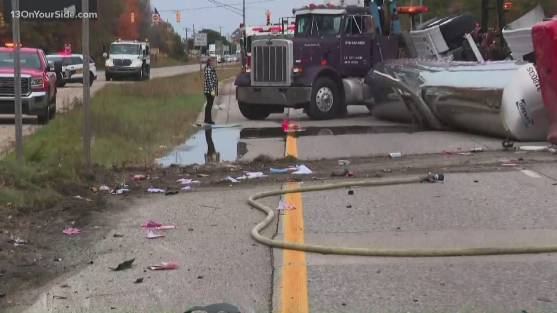 A semi carrying liquid sugar crashed into another vehicle and rolled over, closing down US-31 in Grand Haven and spilling sugar all over the road.