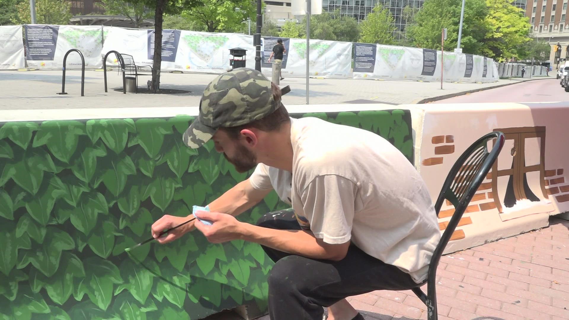 More than 40 artists will be working to paint the barricades over the next month.
