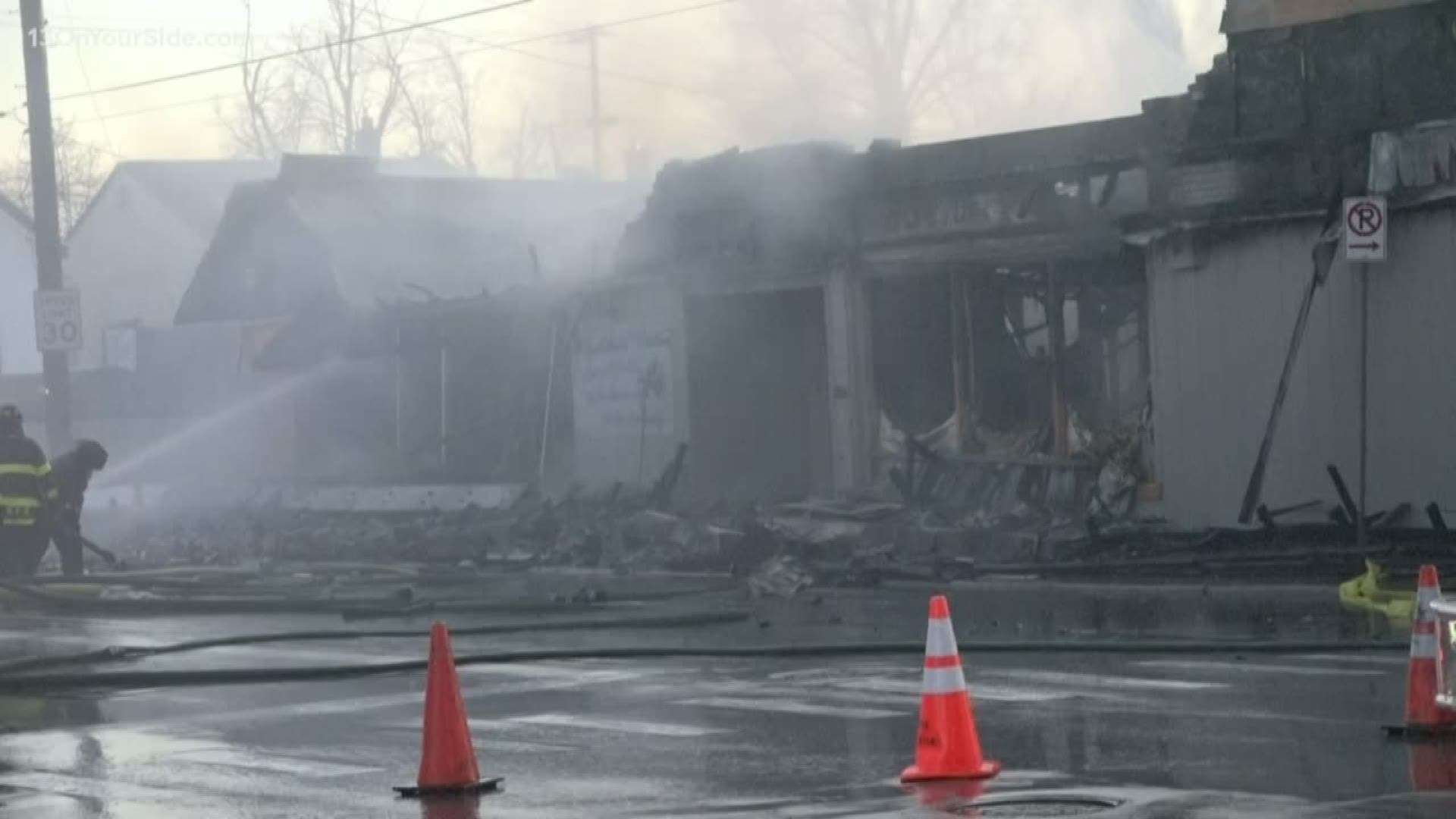 A multi-use building caught fire in Grand Rapids Tuesday. A portion of it collapsed from the damage.