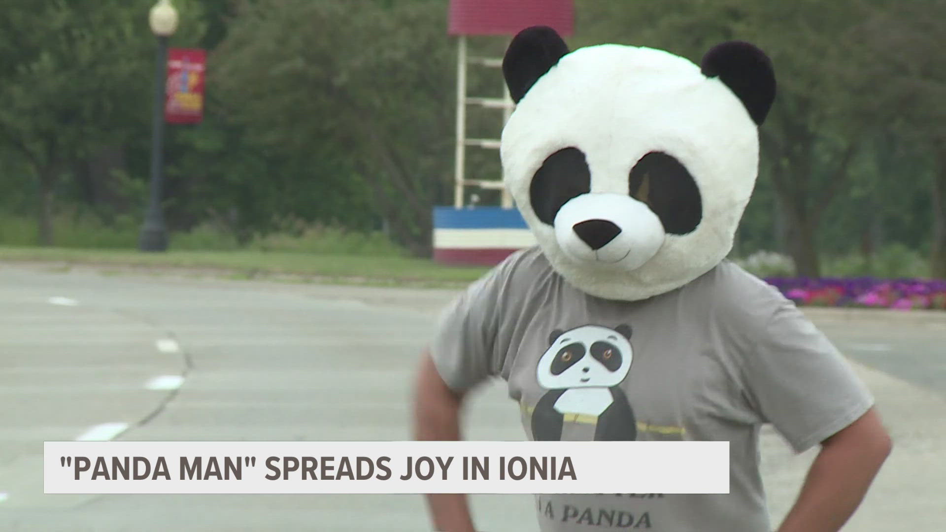 A couple of times a week he walks the streets wearing a panda head, waving and spreading cheer.