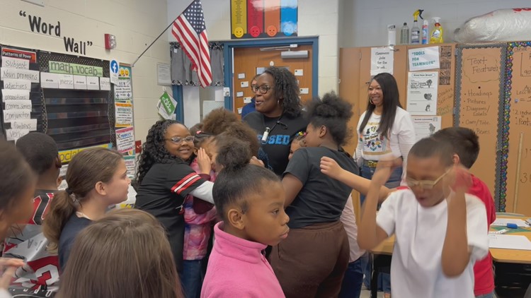Students rejoice and embrace after Teacher of the Week surprise