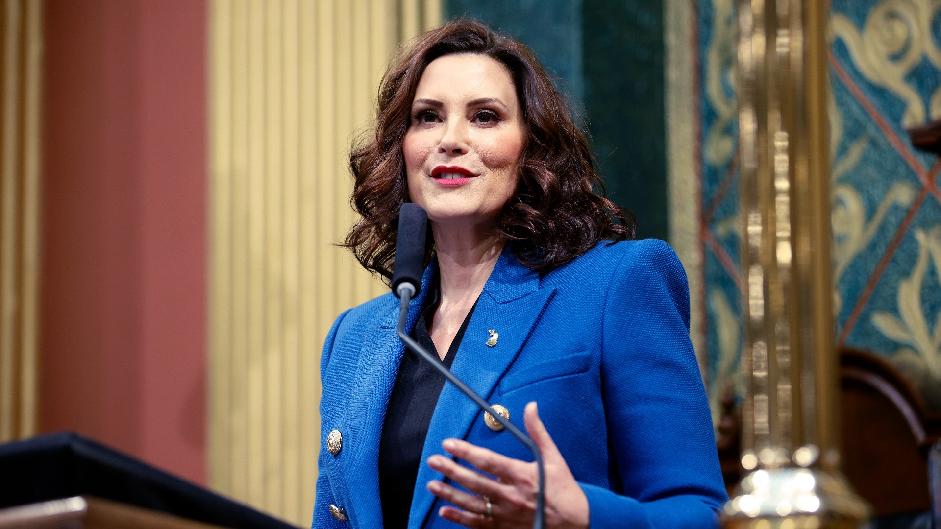 "Our plans are ambitious, but they are achievable. Let's get them done," Whitmer said in her speech as legislative leaders looked on.